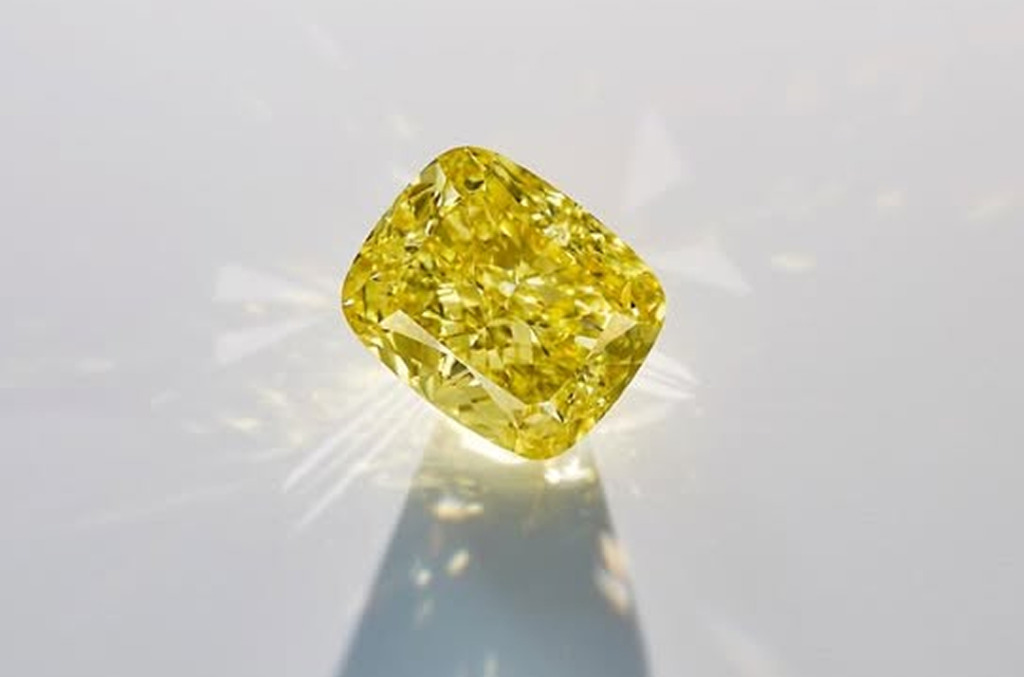 Close-up of a vivid yellow cushion-cut natural diamond