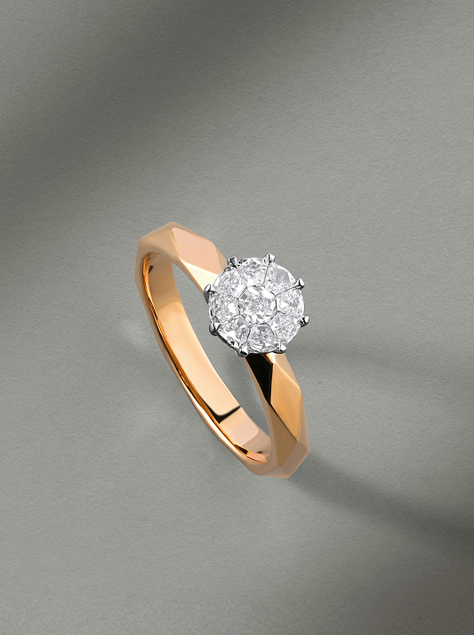 An engagement ring with a rose gold band