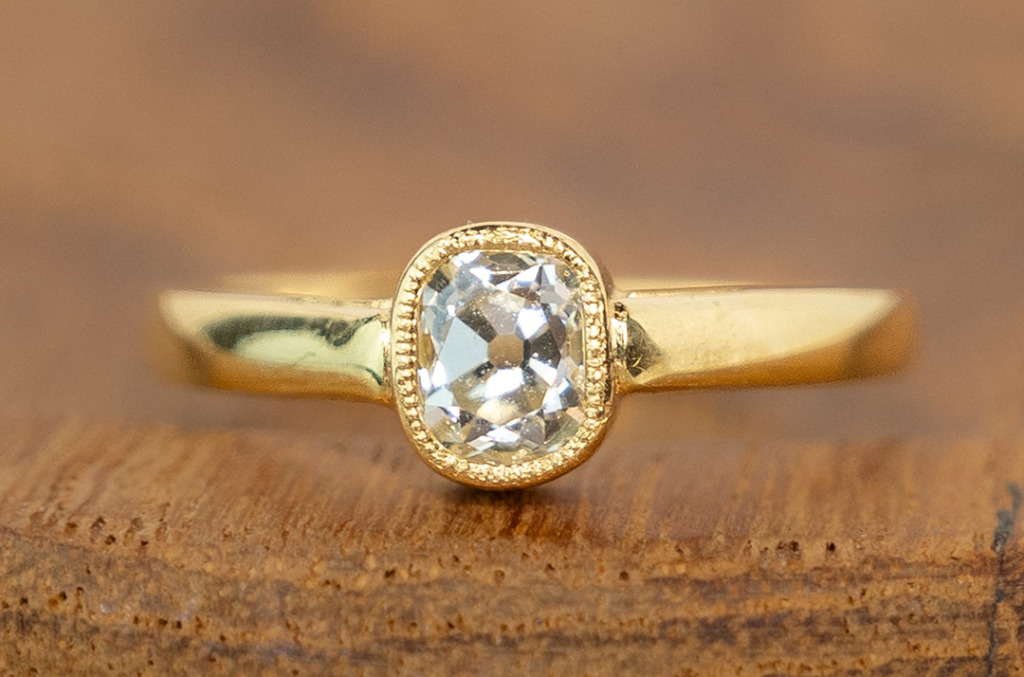 Old mine-cut natural diamond ring set in a yellow gold bezel, featuring a vintage-inspired silhouette and hand-finished detailing.