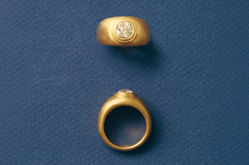 A thick gold and diamond ring by Prounis 