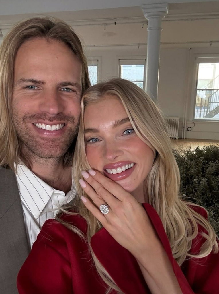 Elsa Hosk and her fiancé posing with her natural diamond engagement ring  