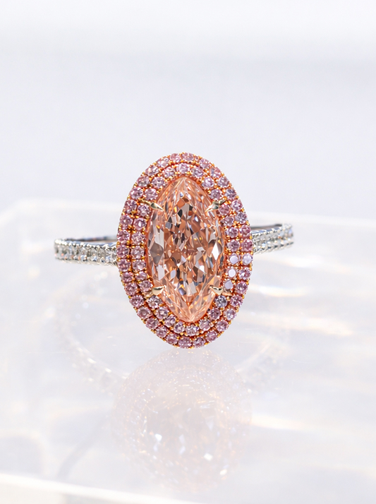 A diamond ring designed by Martin Katz, including a fancy orangey-pink moval diamond and pink and white diamond accents
