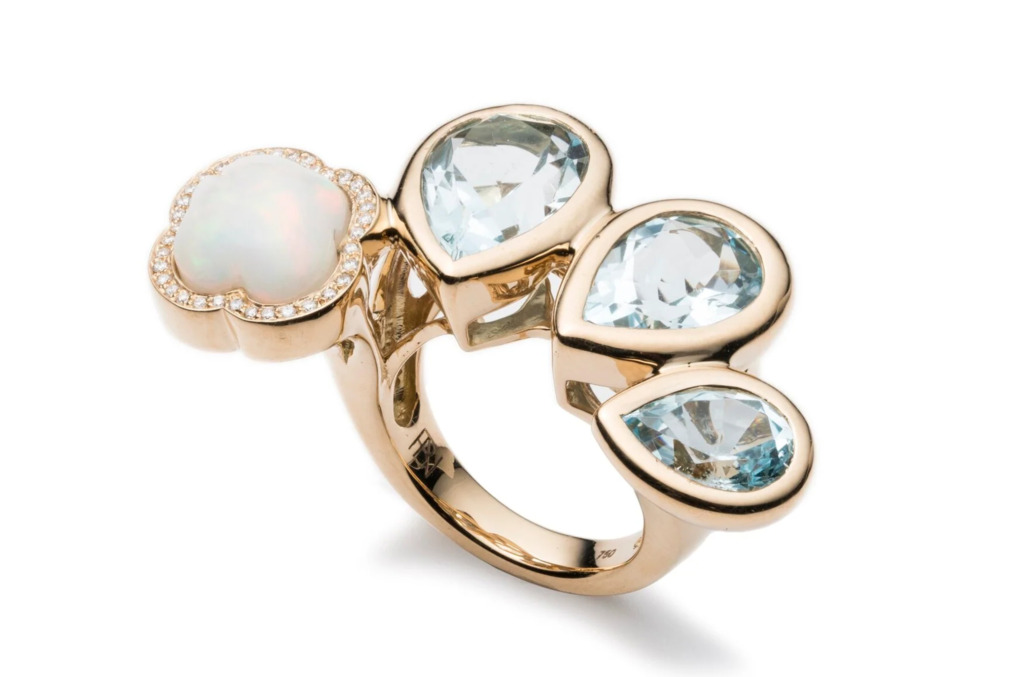 A Brent Neale rain cloud-inspired rings crafted in 18k gold, natural diamonds, opal and blue topaz