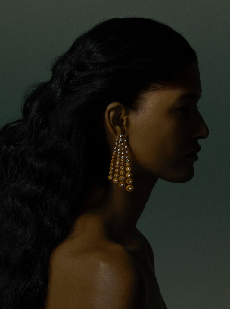 Natural diamond drop earrings worn on a model