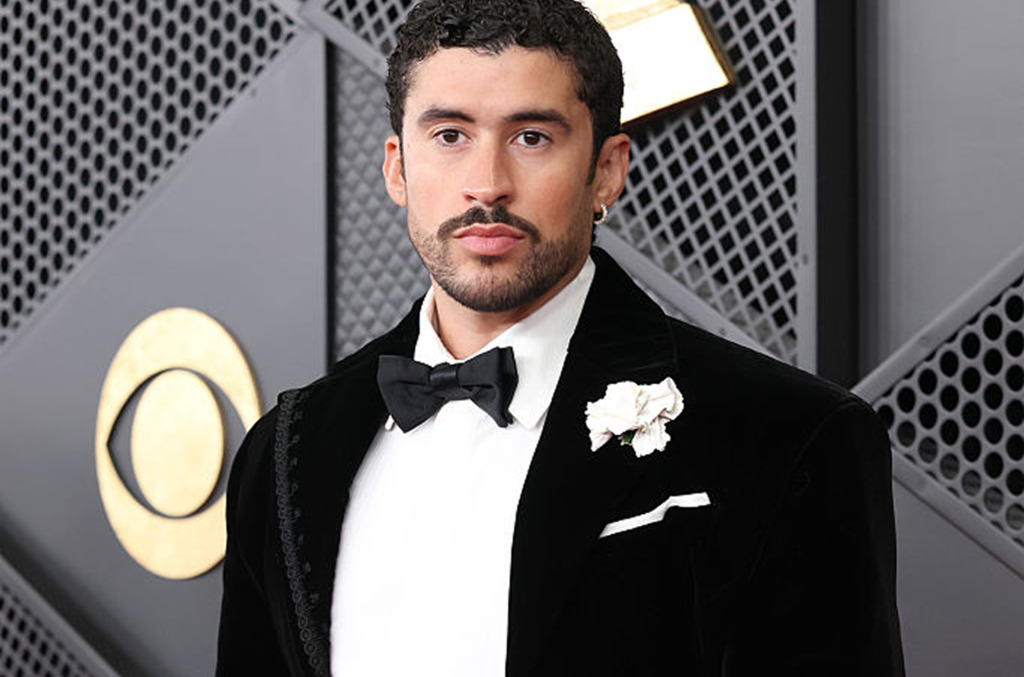 Bad Bunny wearing a natural diamond huggie hoop earring at the 2026 Grammys.