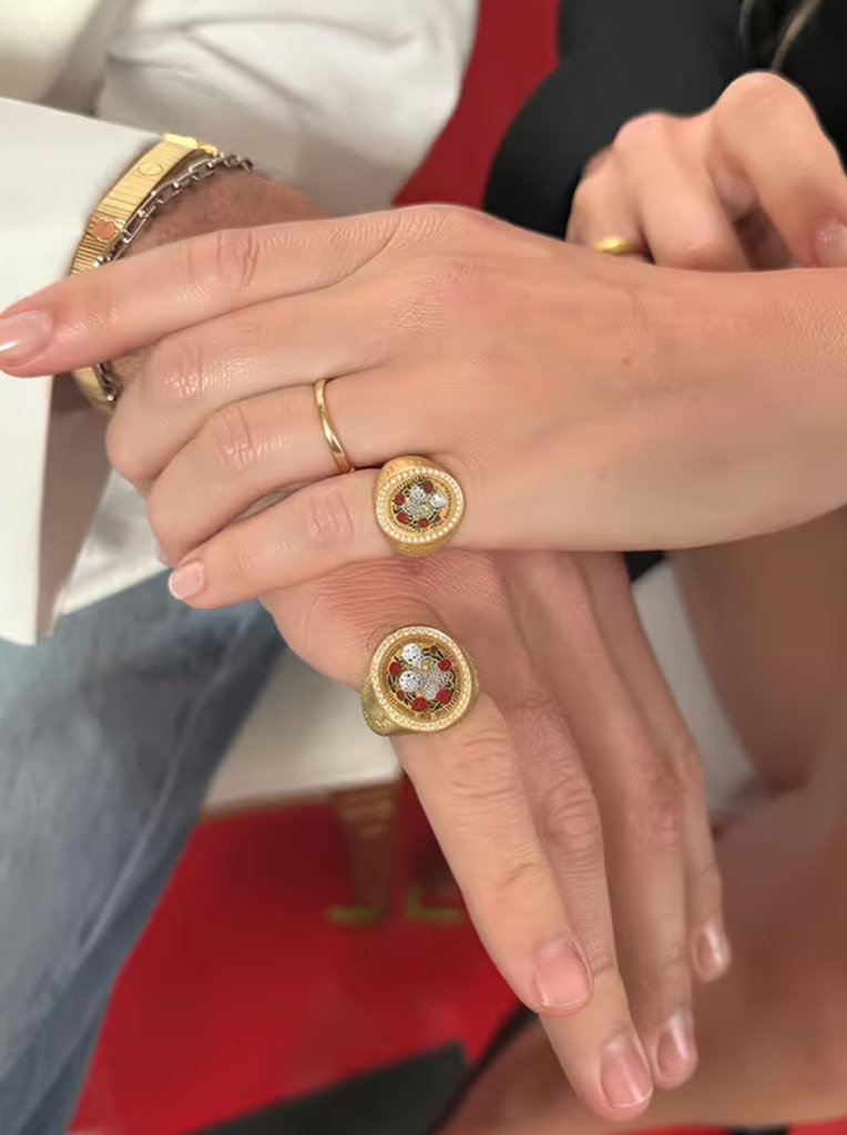 Margot Robbie and Jacob Elordi wearing the bespoke signet rings Robbie commissioned to commemorate filming Wuthering Heights