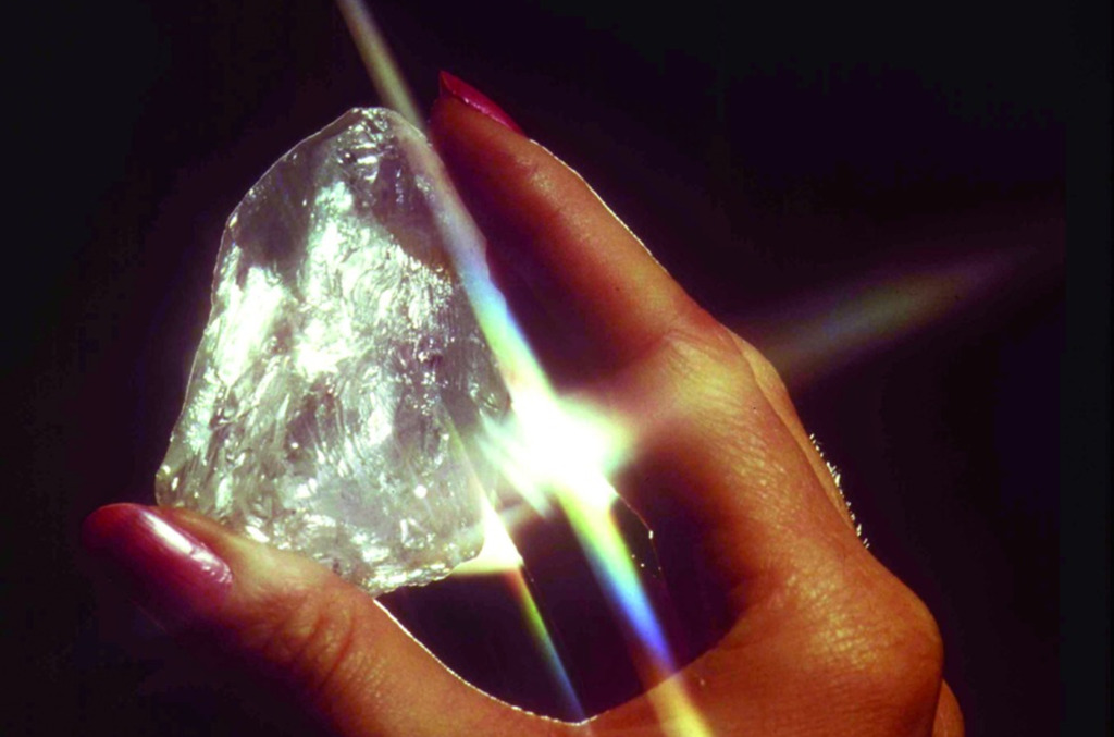 A hand holding the Star of Sierra Leone diamond