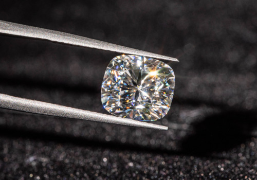 Cushion Cut Diamond Guide Jeweler Loupe Examines A Cushion Cut Diamond Shutterstock 1