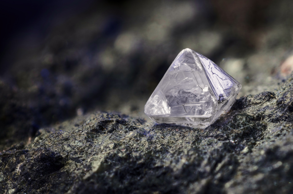 diamond crystal still embedded in surrounding rock