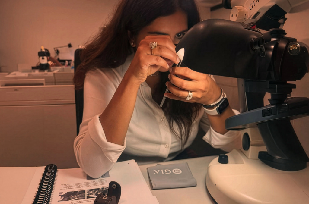  gemologists using specialist equipment to assess a natural diamond