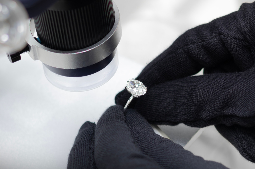 Jeweler Examining A Diamond Image 2