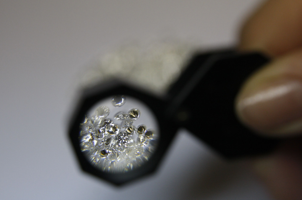 Jeweler Examining A Diamond Image 3
