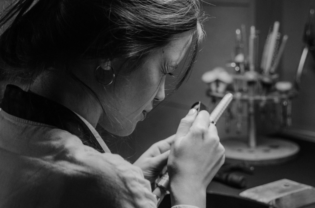 jeweler-inspecting-or-working-on-a-piece-of-jewelry.