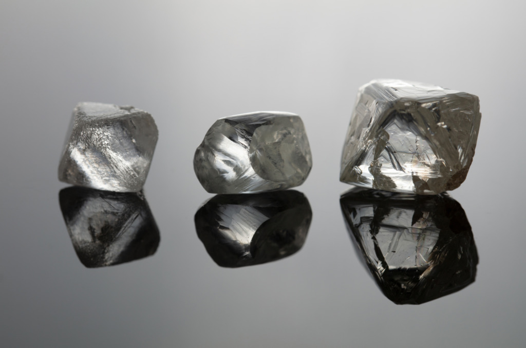 Rough Natural Diamonds Displaying Fluorescence Under Ultraviolet Light